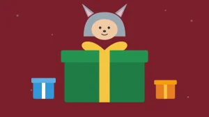 Caja de regalo de amigo invisible con un disfraz pijama de gato asomando
